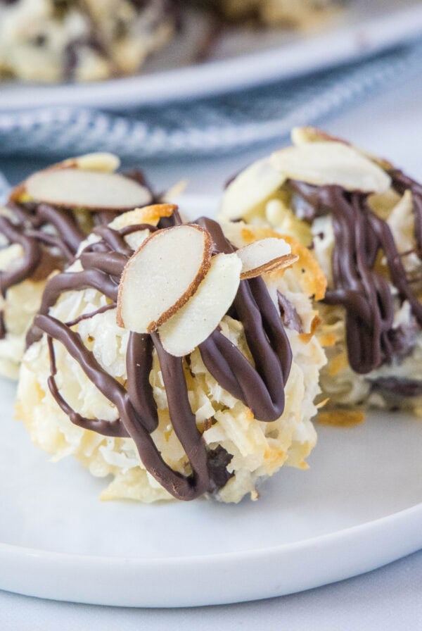 cropped close up almnod joy cookies on a white plate