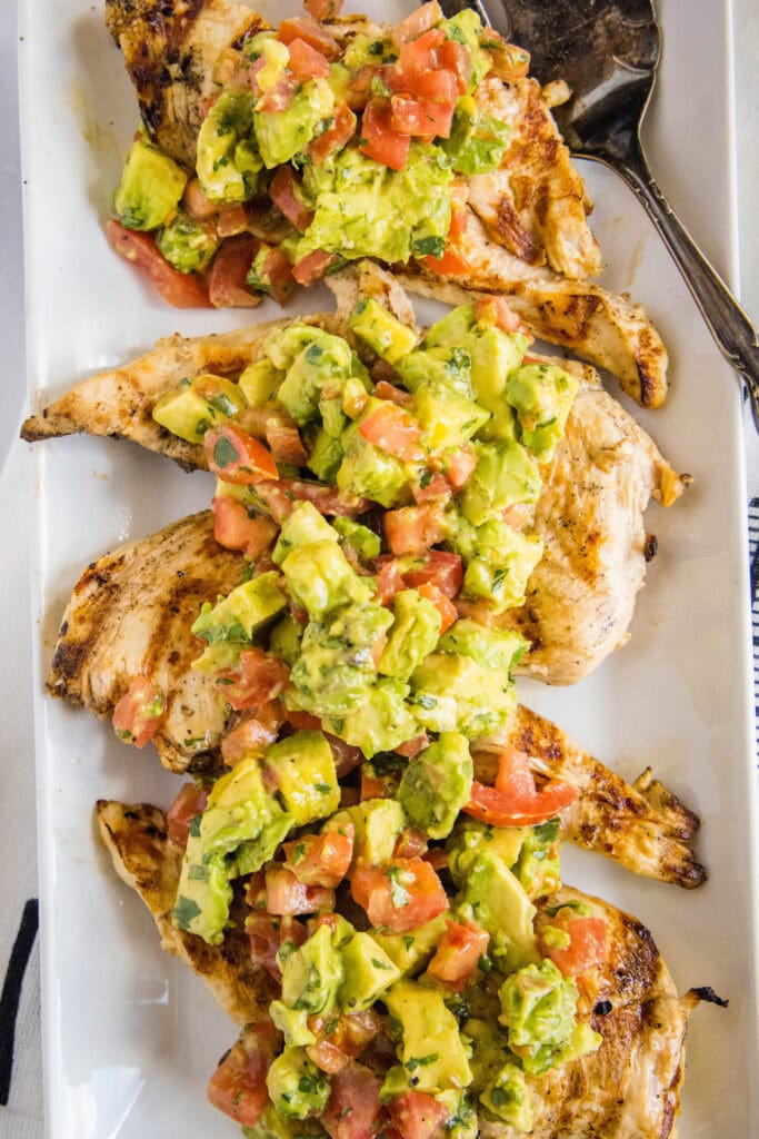 grilled chicken topped with avocado salsa