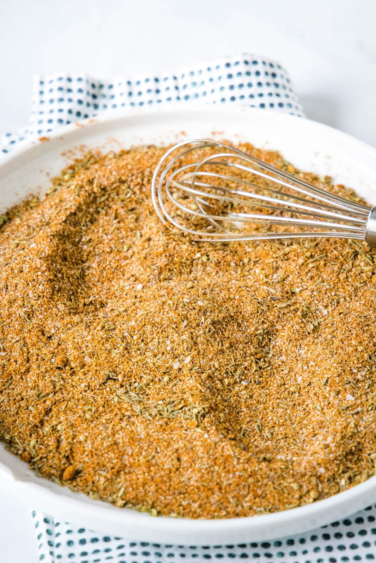 blackened seasoning mixed on a plate with a whisk