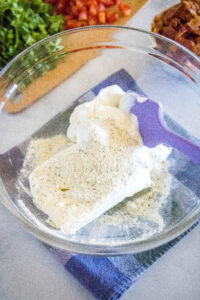 sour cream, cream cheese, ranch seasoning in a mixing bowl