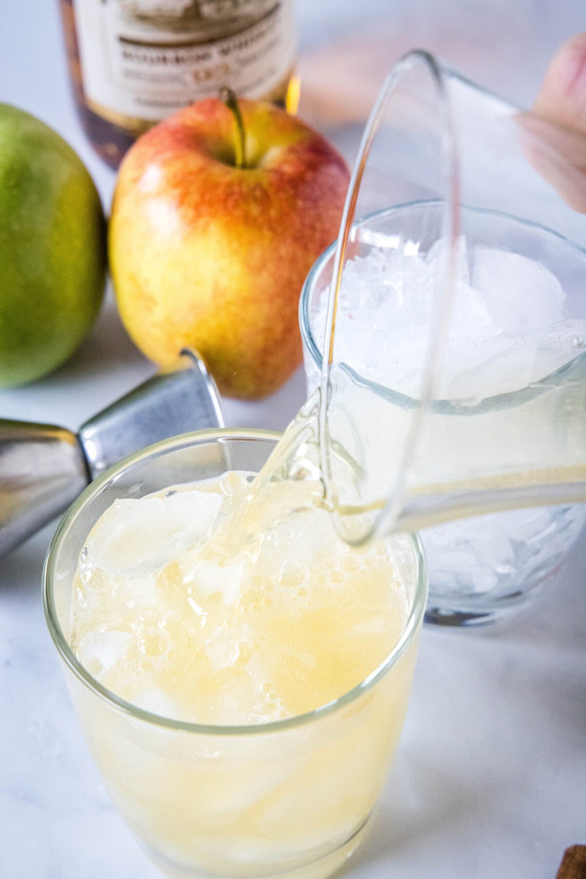 pouring a drink into a glass