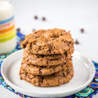 close up of chocolate cookies on white plate