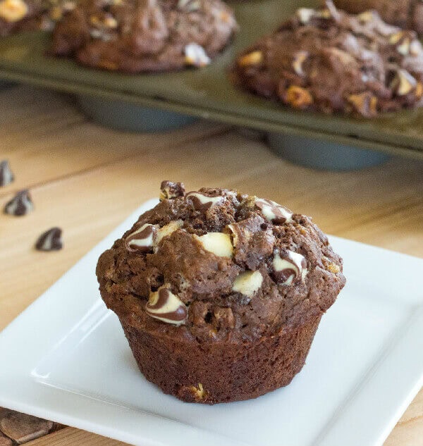 Chocolate Banana White Chocolate Chip Muffins - Moist and tender chocolate and banana muffins with lots of white chocolate chips.