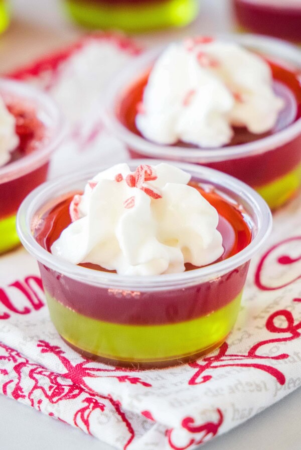 close up christmas jello shots with whipped cream