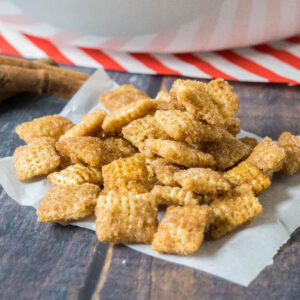 cropped close up churro chex mix on parchment paper