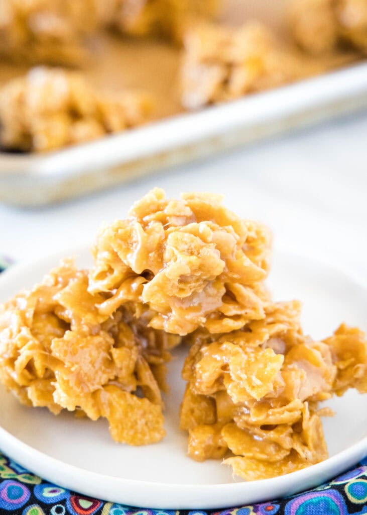 cornflake cookies stacked on a white plate