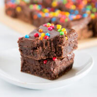 Cosmic Brownies - a homemade version of the childhood favorite. Rich and fudgy brownies topped with a chocolate fudge frosting and rainbow sprinkles.