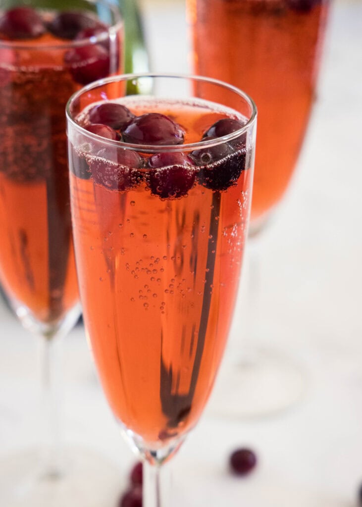 fresh cranberries in a cranberry mimosa drink