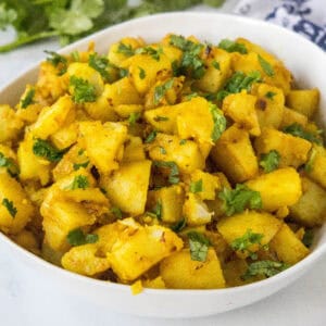 close up curried potatoes in a bowl
