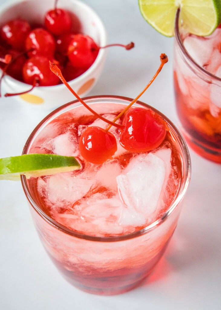 looking down on a glass with a dirty shirley cocktail
