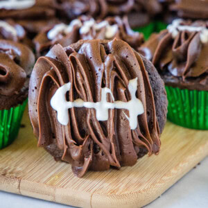 football cupcake on a cutting board