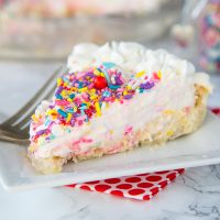 A close up of a piece of Cheesecake pie on a plate