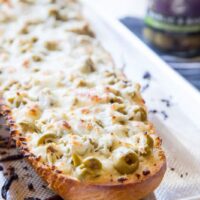 garlic olive cheese bread on a plate