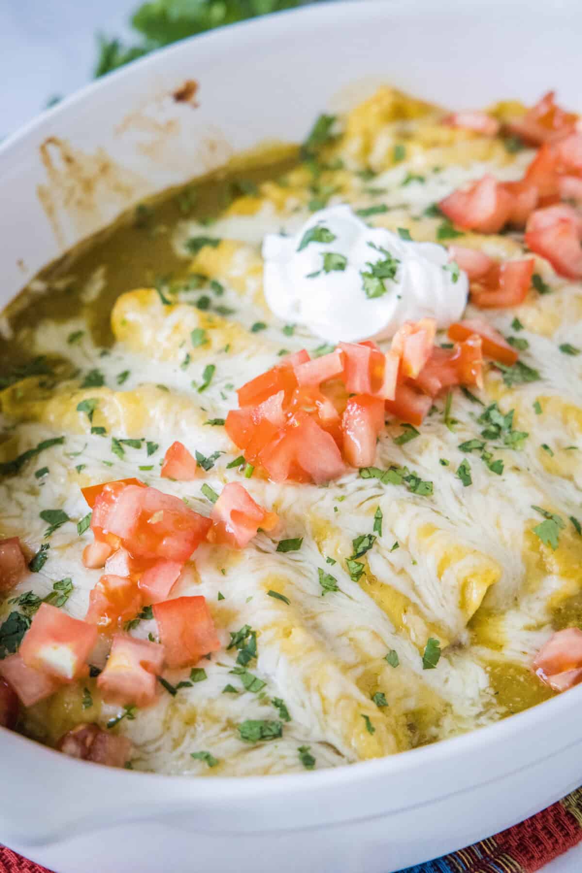 a pan of green chile chicken enchiladas