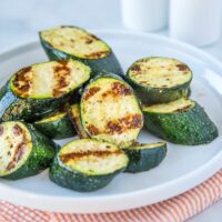 Grilled Zucchini - throw zucchini on the grill for a quick and easy side dish. It is ready in just minutes, is deliciously healthy and perfect with just about any summer meal!