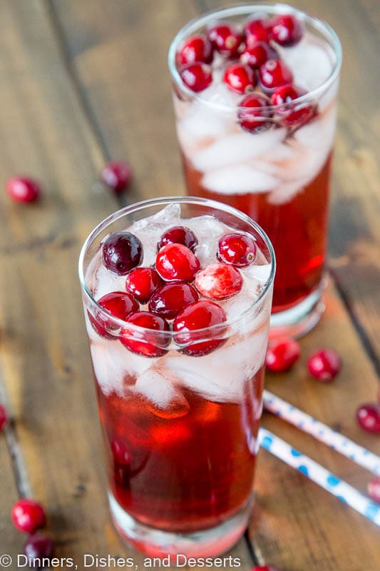 Holiday Wine Spritzer Recipe - a fun cocktail that you can serve at all your holiday get togethers! Wine, ginger ale, cranberry juice and cranberries make it festive and delicious!