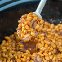 A crock pot with baked beans