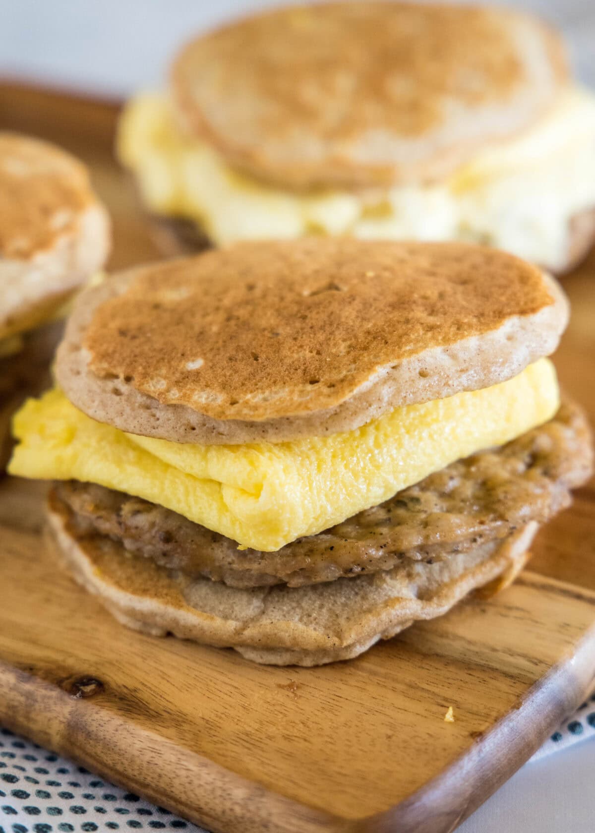 pancake breakfast sandwich on a cutting board