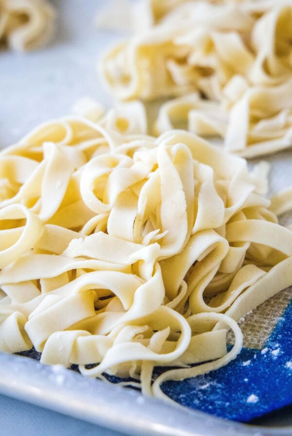 square close up fresh cut pasta on a baking sheet