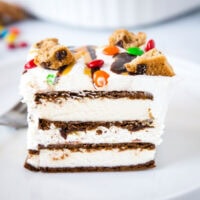 A close up of a slice of cake on a plate, with Cream