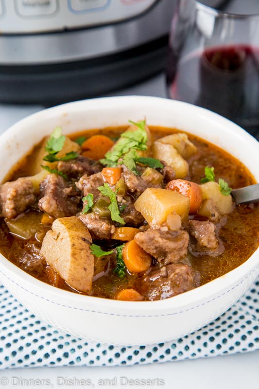 A plate of food with stew, with Beef and Onion