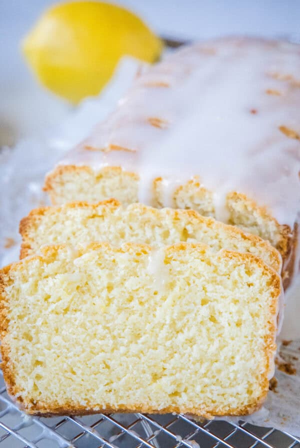 Glazed lemon loaf with two slices cut from the end.
