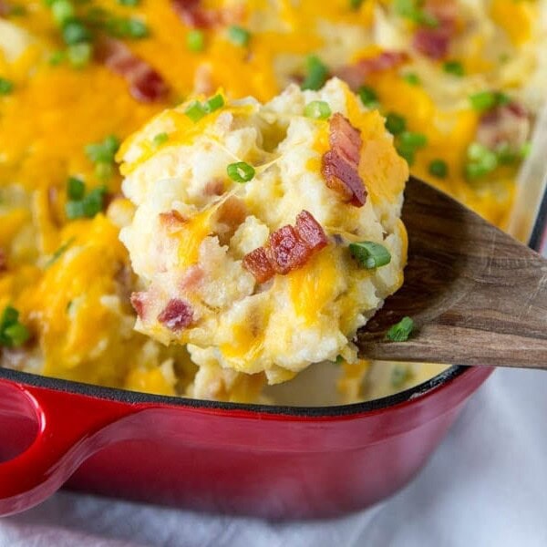 Loaded Twice Baked Potato Casserole - Turn twice baked potatoes into an easy cheesy potato casserole that will be sure to please. Loaded with garlic, cheese, and bacon!