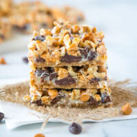 Magic Cookie Bars - These bars come together in one pan and are so easy to make. Layers of graham crackers, chocolate, butterscotch, coconut, nuts and sweetened condensed milk.