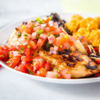 Margarita Grilled Chicken - a super easy copycat recipe from Chili's restaurant. Flavorful chicken grilled and topped with a fresh pico de gallo for an easy and delicious dinner.