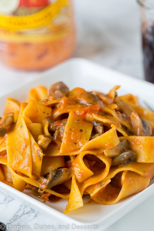 A close up of pasta with a mushroom tomato sauce