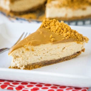close up slice of no bake biscoff cheesecake on a plate