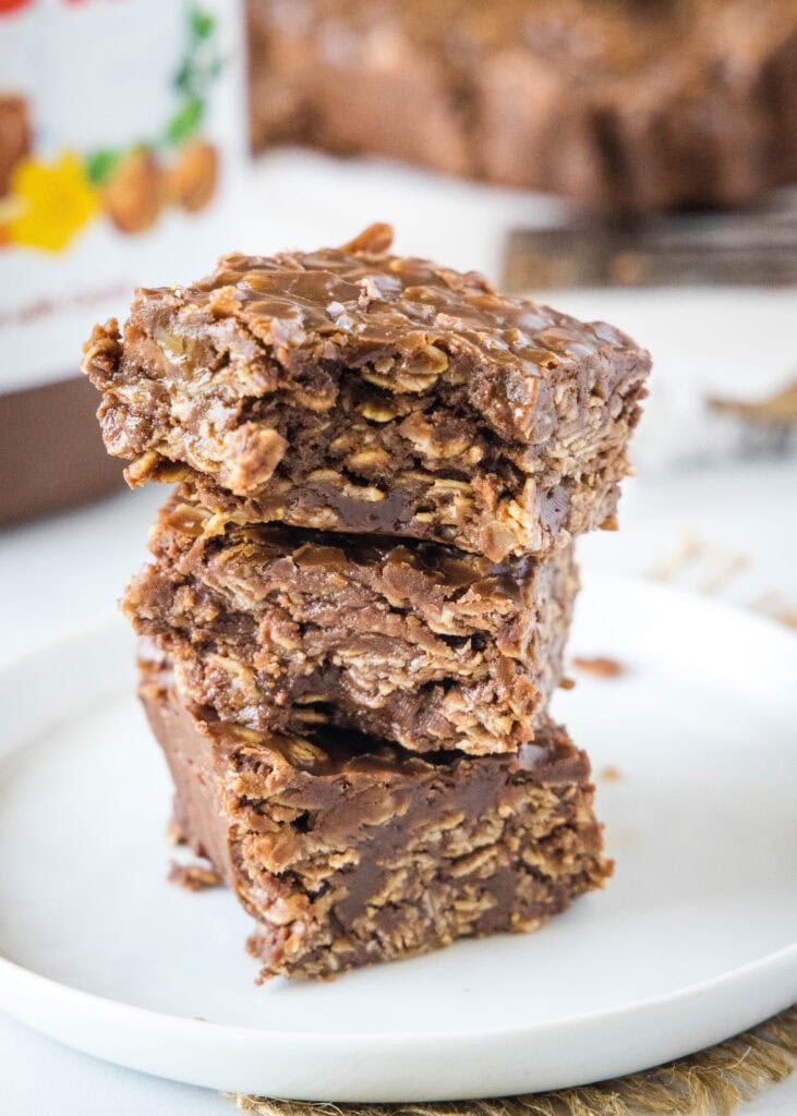 stacked nutella bars on a plate with a bite taken out of one
