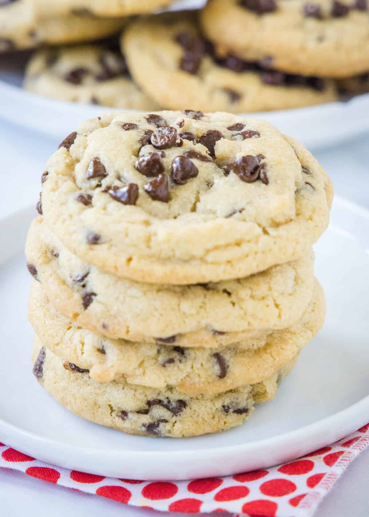Perfect Chocolate Chip Cookies | Dinners, Dishes, and Desserts stacked chocolate chip cookies on a plate
