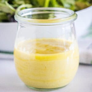 close up roasted garlic vinaigrette in a jar
