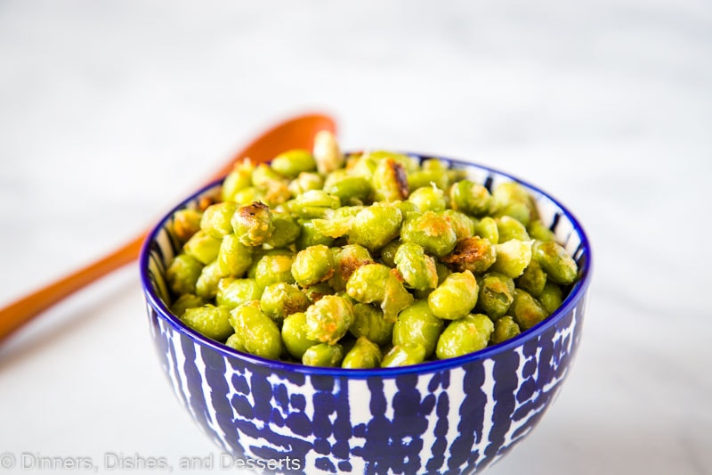 Parmesan Garlic Roasted Edamame - need a new way to get your kids to eat their vegetables? These soy beans are roasted until crispy and coated in Parmesan cheese. Great for picky eaters!Â