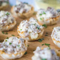 cropped close up sausage cup on cutting board