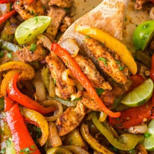 cropped close up chicken fajitas on a sheet pan
