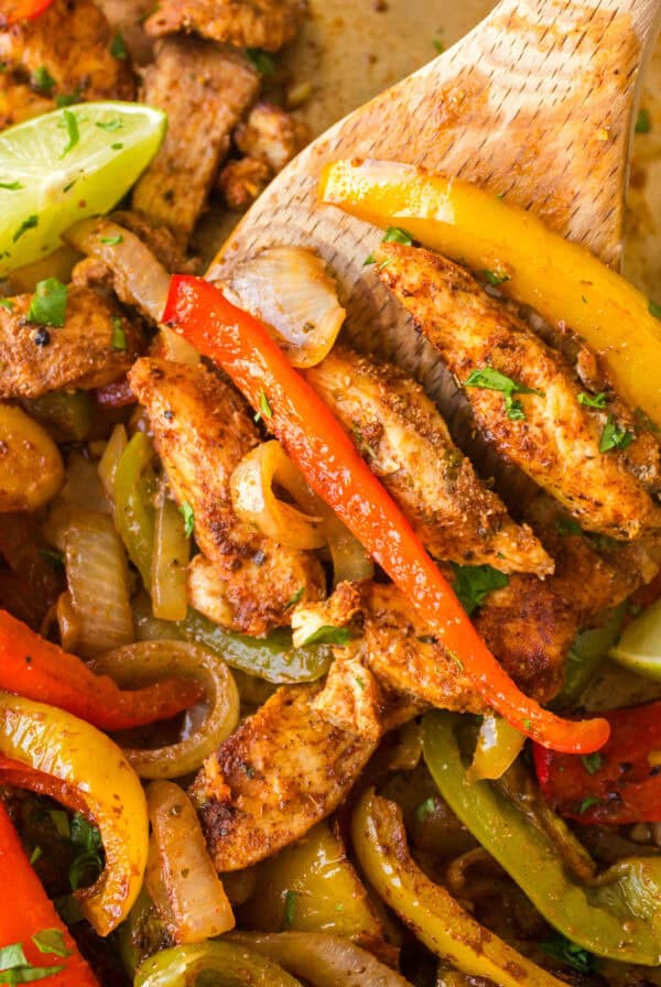 cropped close up chicken fajitas on a sheet pan