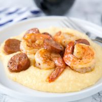 Shrimp and Grits Recipe - this easy shrimp and grits is ready in minutes and is perfect for busy weeknights. Cheesy grits take it over the top, the whole family is going to love it!