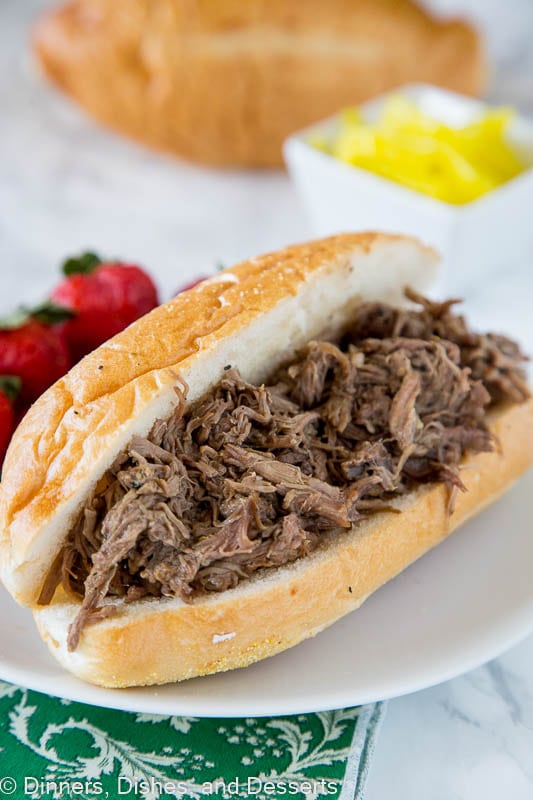 Slow Cooker Italian Beef - use your crock pot to make these super tender Italian Beef Sandwiches. Cooks all day in great spices, for a tender and flavorful dinner.