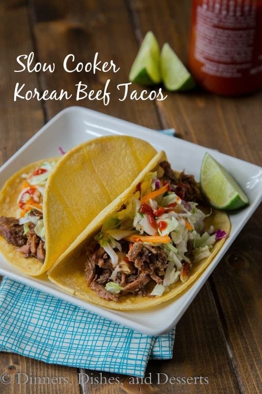 Slow Cooker Korean Beef Tacos - Let your crock pot do the work and get perfectly tender, sweet and spicy beef that is perfect piled on a tortilla topped with a little Korean coleslaw.