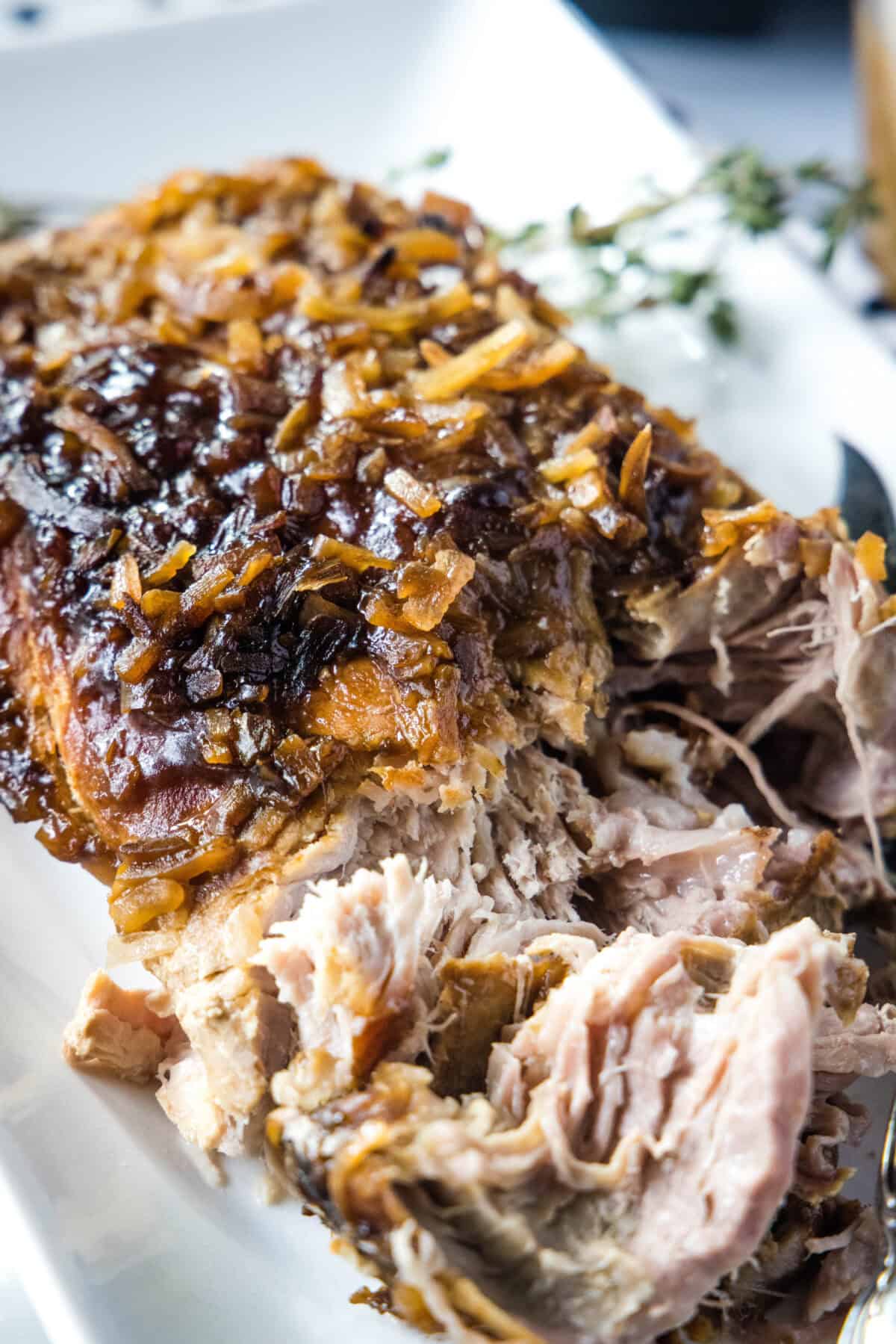 slow cooker pork roast on a white plate