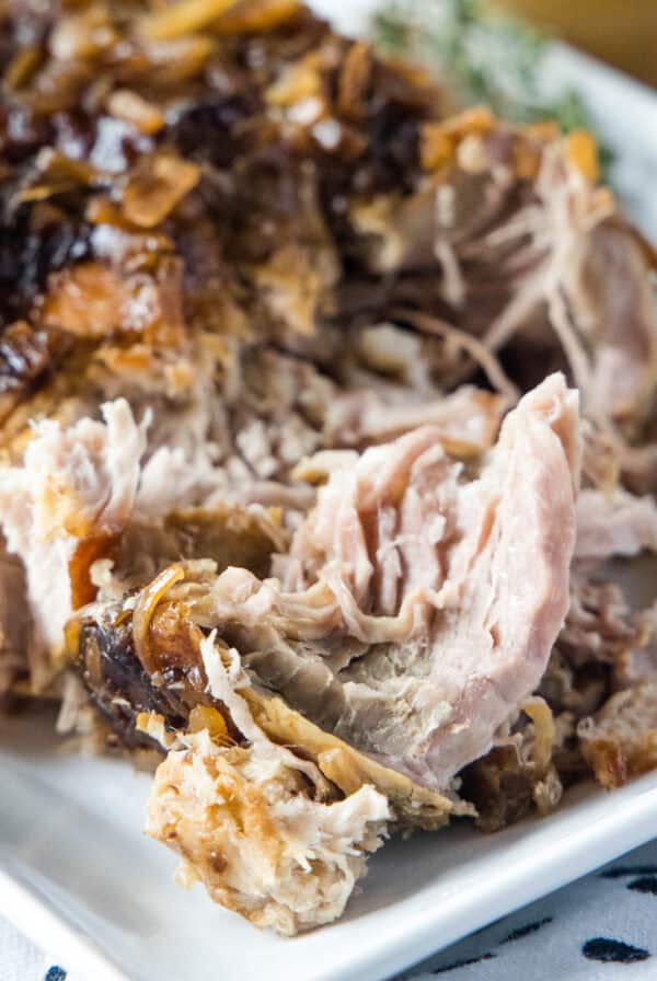 close up pork roast from the crock pot on a plate