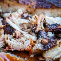 Smoked Pork Belly - the most tender and juicy pork you will ever have! It is cooked low and slow on the smoker and seasoned with a delicious rub. Super easy, you will wonder why you have never tried it before!