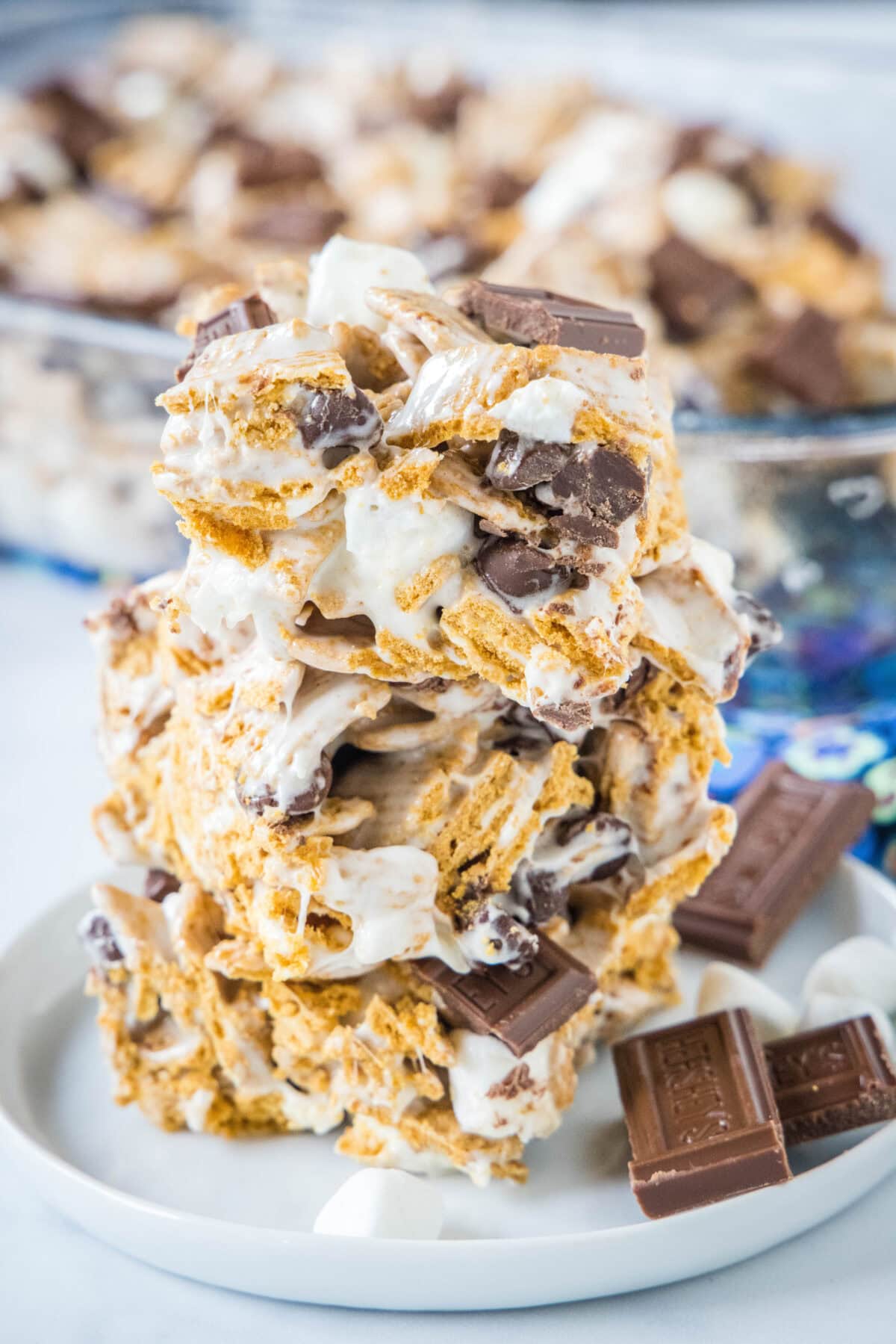 stacked s'mores rice krispie treats stacked on a white plate