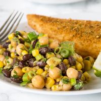 Southwestern Chickpea Salad - chickpeas and black beans with corn and avocado in a Southwestern style dressing. A great healthy and fresh summer side dish.