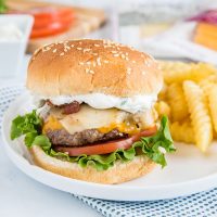 Spicy Bacon Cheeseburger - get ready for summer with easy homemade hamburgers topped with bacon, cheese, and a spicy ranch sauce!
