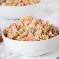 Taco Pasta Salad - a creamy pasta salad with all your favorite taco toppings! Great to make ahead and have in the fridge for dinner or to take to any get together.