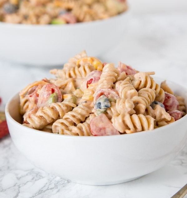 Taco Pasta Salad - a creamy pasta salad with all your favorite taco toppings! Great to make ahead and have in the fridge for dinner or to take to any get together.
