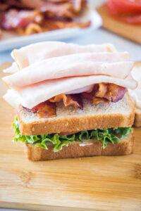 turkey and bacon on a slice of bread